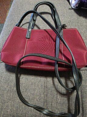 Nine West Handbag with a burgundy lining and magnetic closure